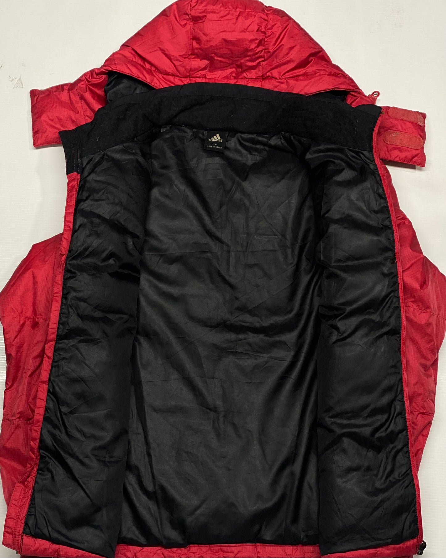 Adidas puffer jacket in red and black